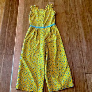 Beautiful floral jumpsuit! Buttoned in the back, so comfy! Size 8